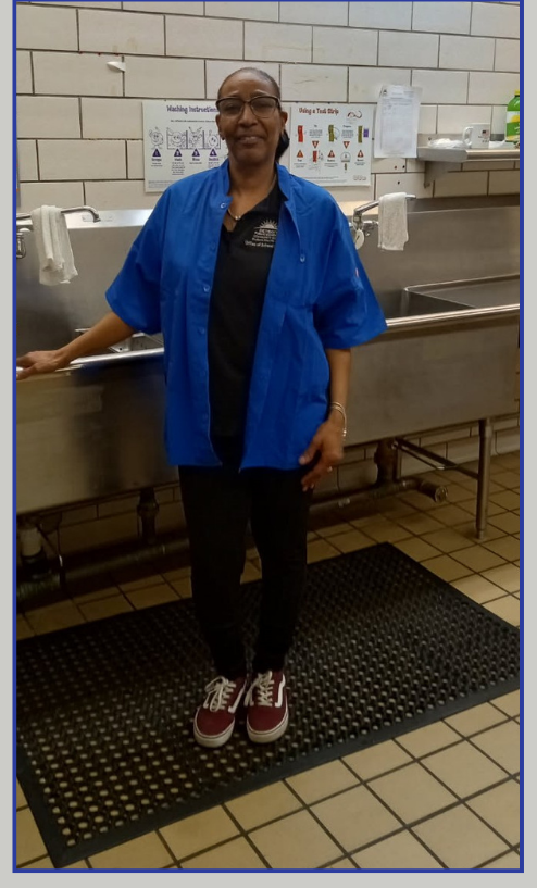  Ms. Powell standing in the kitchen